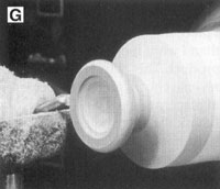 Use the spindle gouge to refine the shape