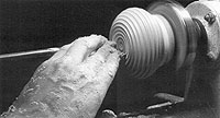 For added decoration, the author often cuts coves across the entire recessed bottom of the lamp.