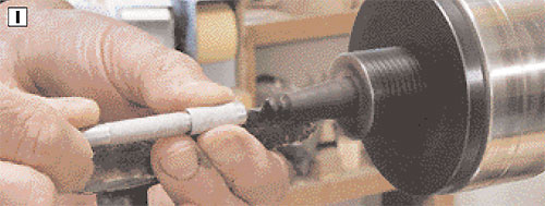 I then drill another small hole with a pin vise in the ebony knob to accept a screw eye for hanging the ornament.