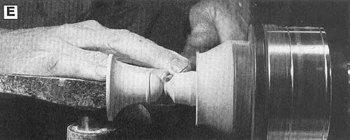 Refine the top of the bell before parting it from the lathe.